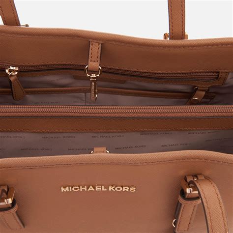 michael kors jet set travel east west pebble leather tote|Michael Kors saffiano jet set.